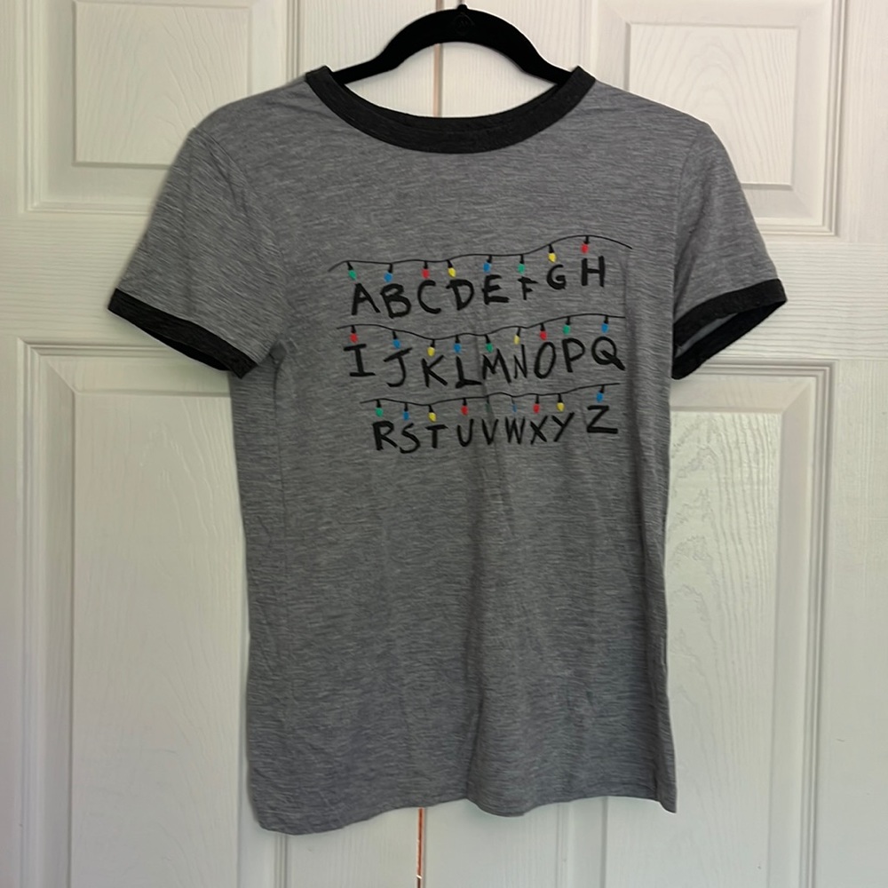 Stranger things official T-shirt. Alphabet christmas lights.